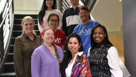 PhD students with Dean Sarah Rhoads